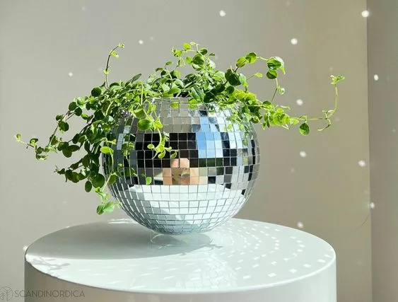 Eco-friendly disco ball planter construction from recycled items